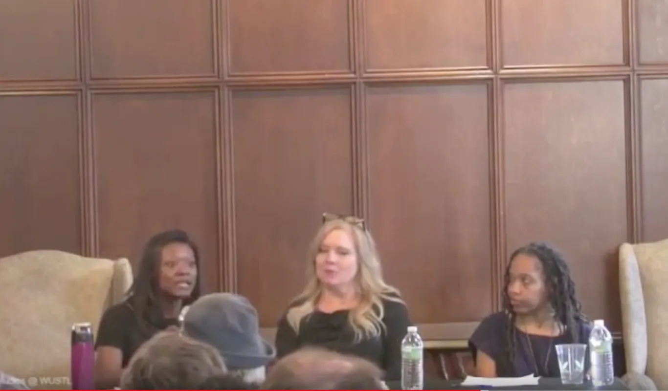 3 panelists at table with microphones